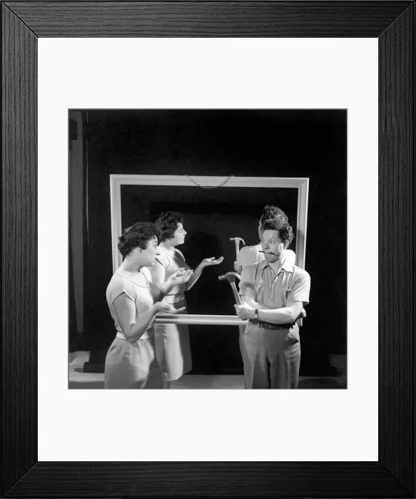 Framed Print : Mirror image: A couple argue in front of a mirror. 1958 Framed Print : Mirror image: A couple argue in front of a mirror. 1958