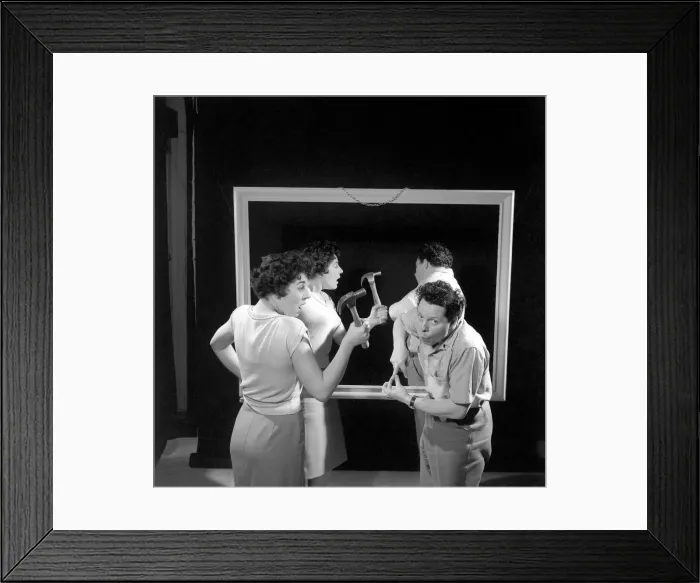 Framed Print : Mirror image: A couple argue in front of a mirror. 1958 Framed Print : Mirror image: A couple argue in front of a mirror. 1958
