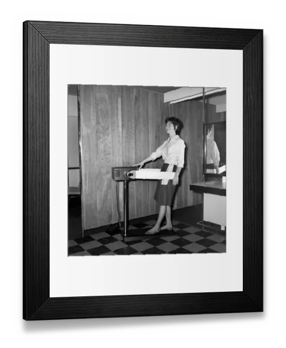 Framed Print : Woman at the John London Hair and Beauty Saloon seen here using a band vibrating slimming