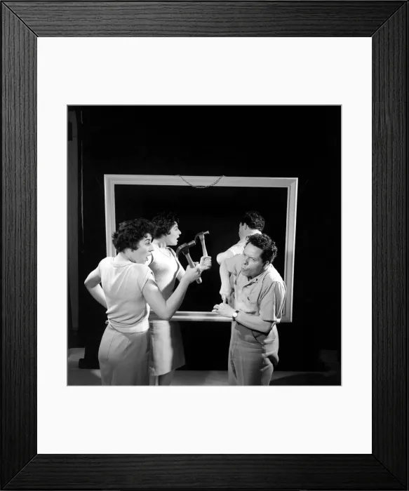 Framed Print : Mirror image: A couple argue in front of a mirror. 1958 Framed Print : Mirror image: A couple argue in front of a mirror. 1958
