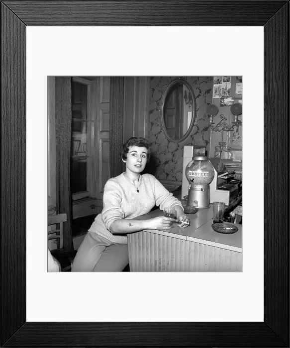 Framed Print : Woman enjoying a cigarette and a drink in a London bar. 1960 Framed Print : Woman enjoying a cigarette and a drink in a London bar. 1960