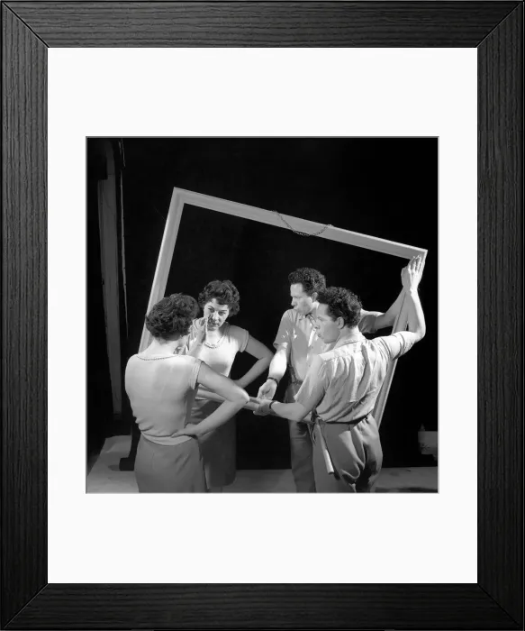 Framed Print : Mirror image: A couple argue in front of a mirror. 1958 Framed Print : Mirror image: A couple argue in front of a mirror. 1958