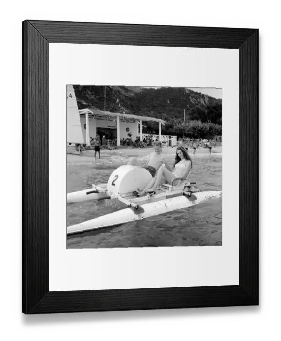Framed Print : Holidays: Couple riding on a pedalo off the coast of Corsica. August 1957