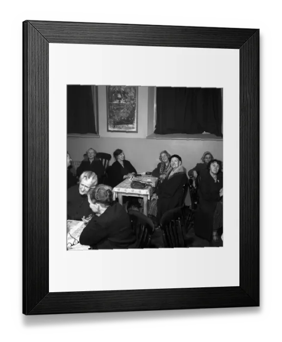 Framed Print : Women chat, share a cup of tea and read the newspapers at a womens lodging house