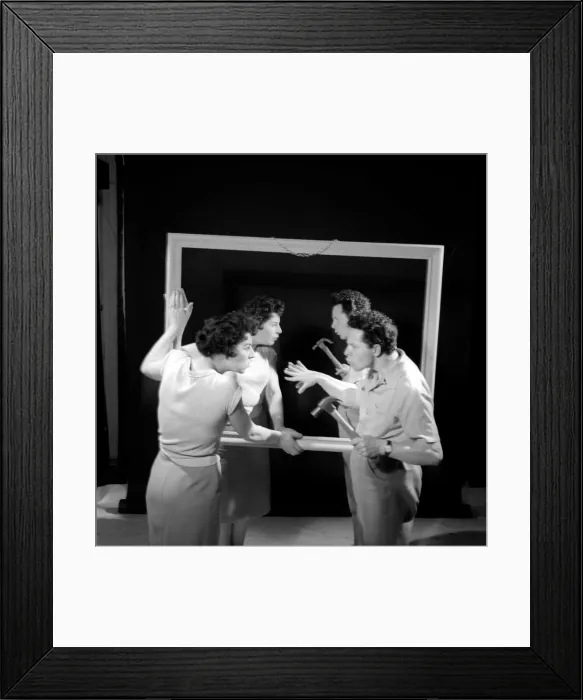 Framed Print : Mirror image: A couple argue in front of a mirror. 1958 Framed Print : Mirror image: A couple argue in front of a mirror. 1958