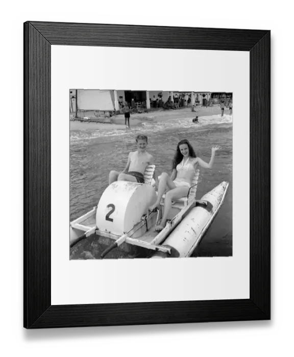 Framed Print : Holidays: Couple riding on a pedalo off the coast of Corsica. August 1957 Framed Print : Holidays: Couple riding on a pedalo off the coast of Corsica. August 1957