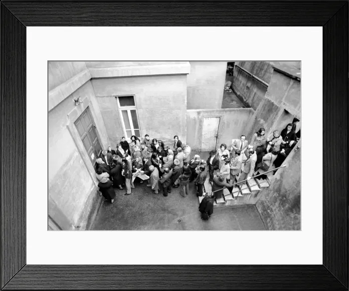 Framed Print : A group of people queuing to enter a building in a suburb on the outskirts of Rome