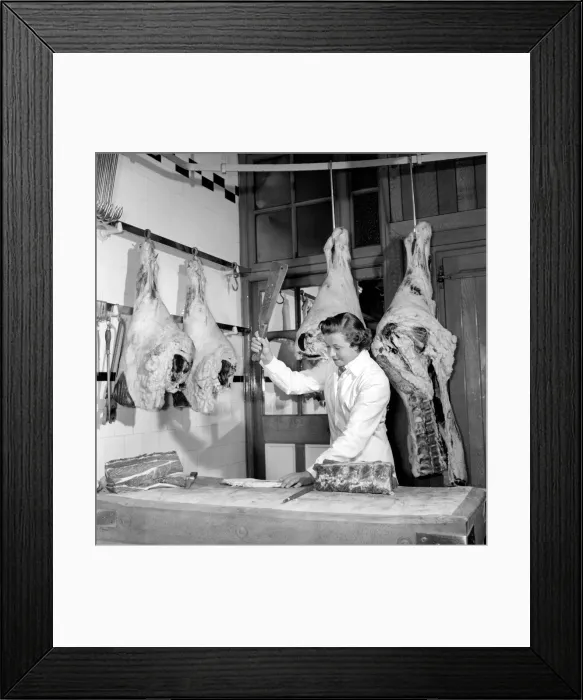 Framed Print : Woman butcher seen here at work. 1954 Framed Print : Woman butcher seen here at work. 1954