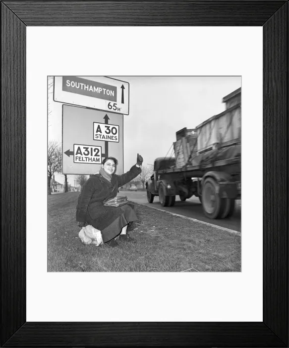 Framed Print : Girl hitch-hiking on the A30. to Southampton Circa 1957