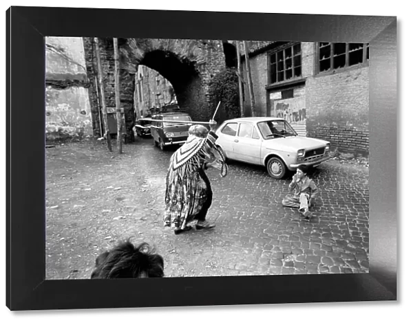 Woman and child in the streets in a poor suburb on the outskirts of Rome