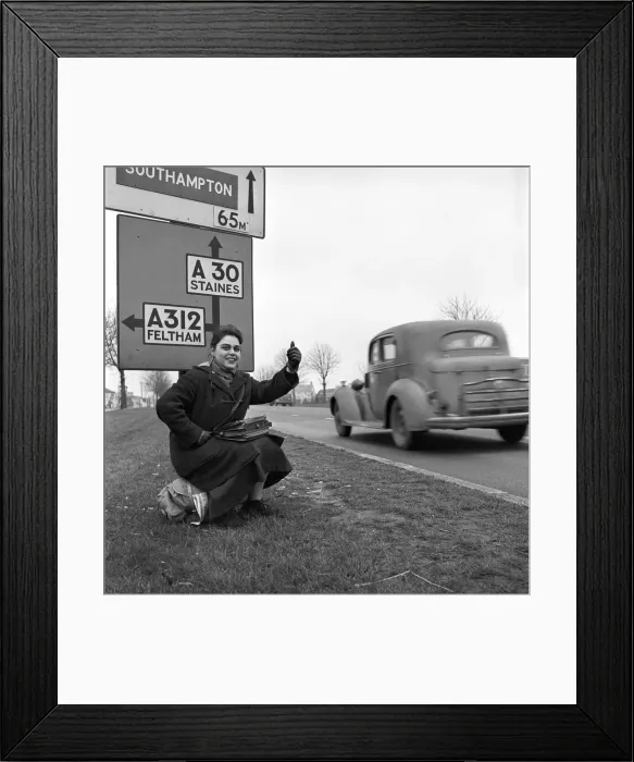 Framed Print : Girl hitch-hiking on the A30. to Southampton Circa 1957 Framed Print : Girl hitch-hiking on the A30. to Southampton Circa 1957