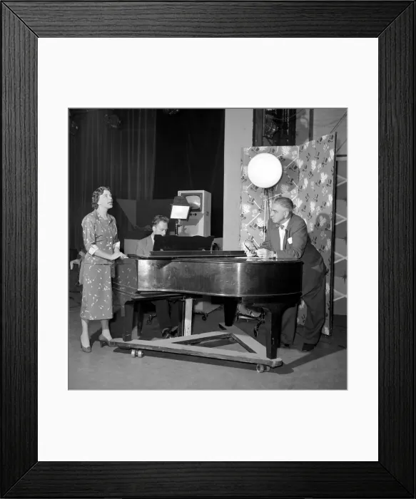Framed Print : TV presenter Fred Wilby seen here beside the piano in the studios of Midland TV