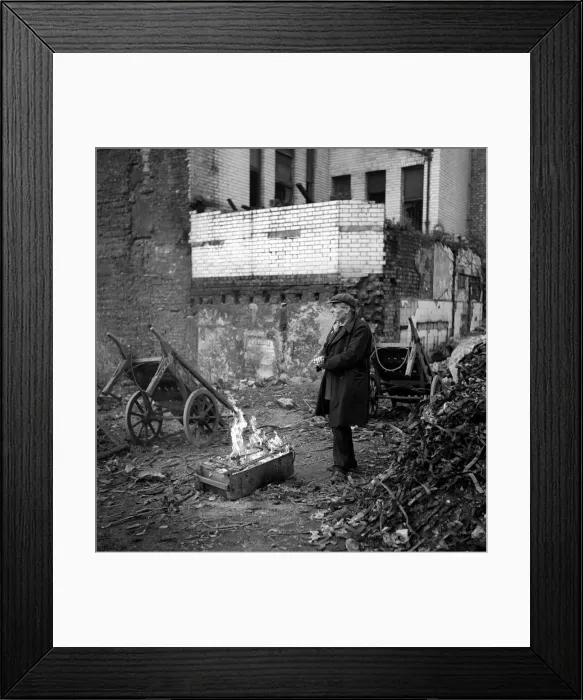 Framed Print : Tramps: One of two homeless gentlemen who live in the cellar of a bombed out building