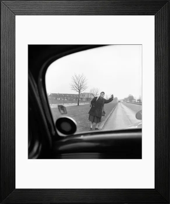 Framed Print : Girl hitch-hiking on the A30. to Southampton Circa 1957 Framed Print : Girl hitch-hiking on the A30. to Southampton Circa 1957