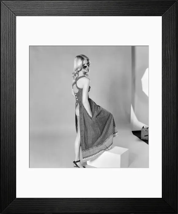 Framed Print : German glamour model Maureen wearing a sleeveless open backdress. April 1975 Framed Print : German glamour model Maureen wearing a sleeveless open backdress. April 1975