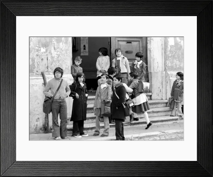 Framed Print : Young children on the steps of their school building in a poor suburb on the outskirts Framed Print : Young children on the steps of their school building in a poor suburb on the outskirts