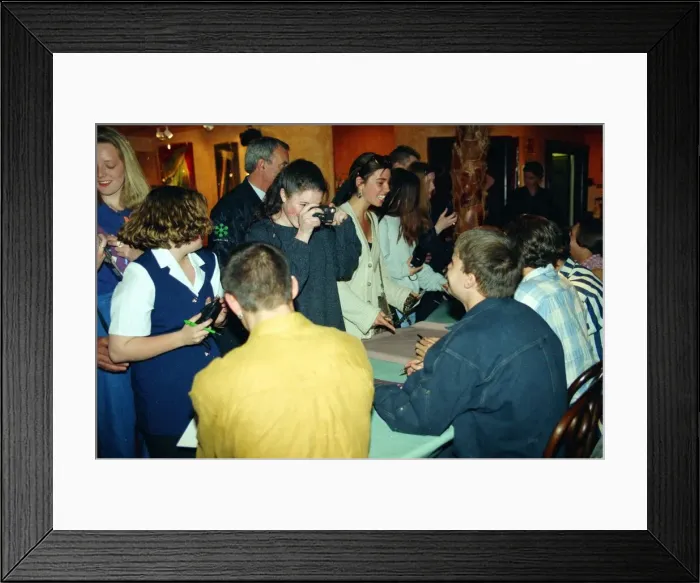 Framed Print : Pop group Take That sign autographs and pose for pictures for girl fans at a signing Framed Print : Pop group Take That sign autographs and pose for pictures for girl fans at a signing