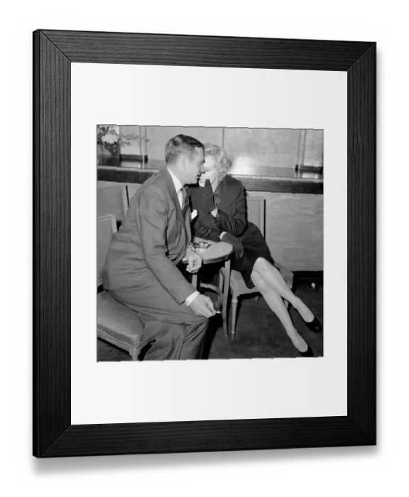 Framed Print : The Prince and the Showgirl. Marylin Monroe and Laurence Olivier at a publicity