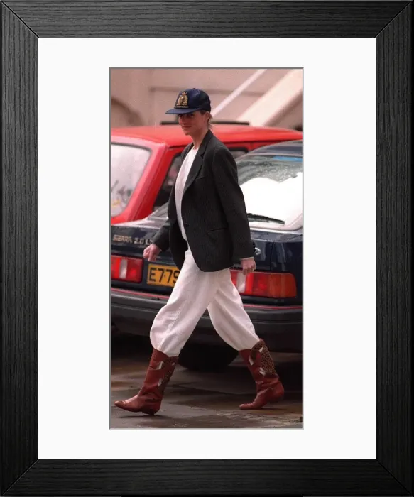 Framed Print : Princess Diana wearing an unusual combination of white trousers, boots Framed Print : Princess Diana wearing an unusual combination of white trousers, boots