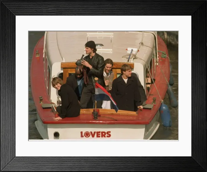 Framed Print : Take That in the Netherlands after their final concert, leaving on a canal tazi as fans