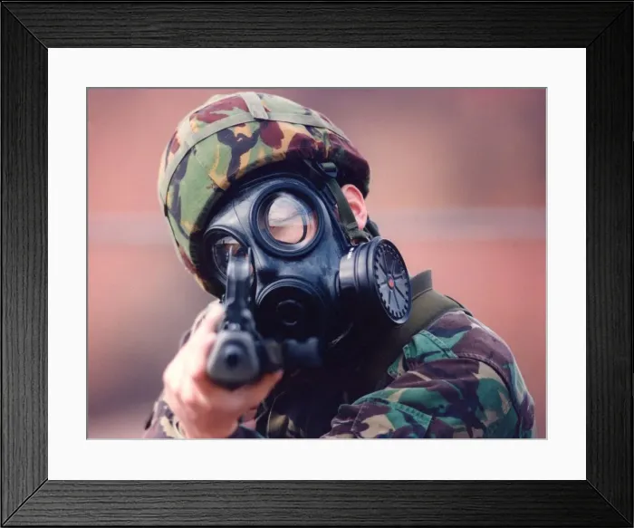 Framed Print : A Royal Marine in camouflage and gasmask Framed Print : A Royal Marine in camouflage and gasmask