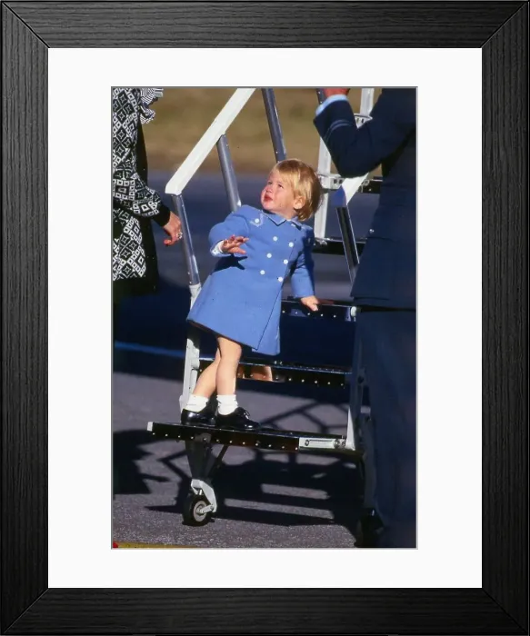 Framed Print : Prince Harry July 1987 wearing a blue coat standing on the steps of a plane