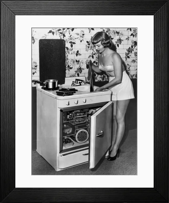 Framed Print : A woman washing her nylons in an all in one refrigerator Framed Print : A woman washing her nylons in an all in one refrigerator