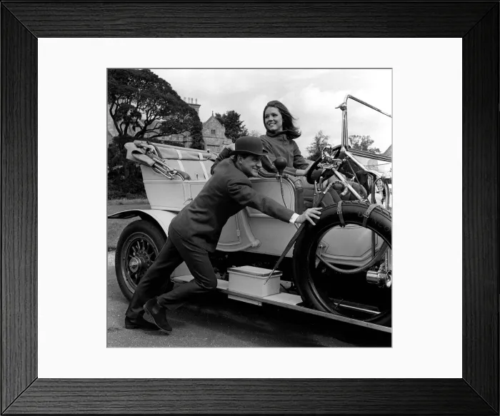 Framed Print : Patrick Macnee & Diana Rigg stars of The Avengers pushing a vintage car on set