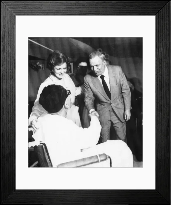 Framed Print : Frank Sinatra with Mrs Jihah Sadat touring the Wafa Wal centre for the handicapped in