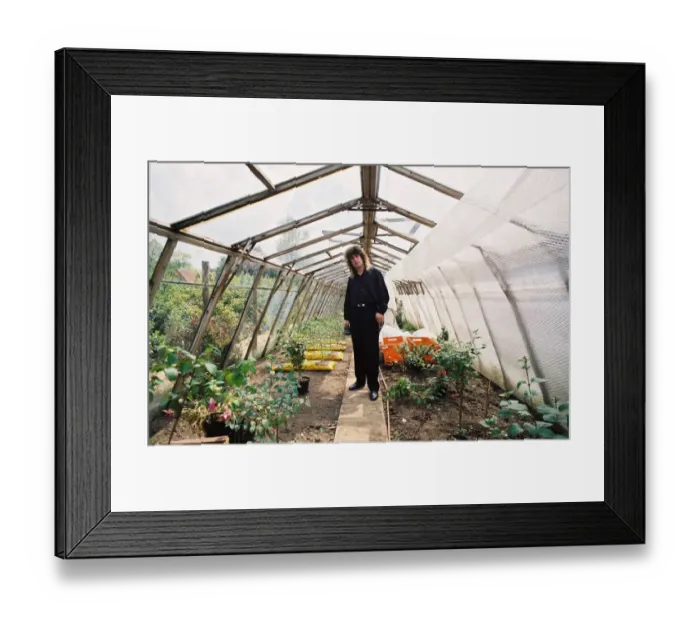 Framed Print : Ozzy Osbourne in his greenhouse in the garden of his home. May 1988
