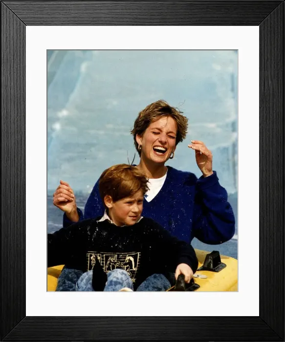 Framed Print : Princess Diana and Prince Harry laughing and getting soaked on water slide ride in Thorpe