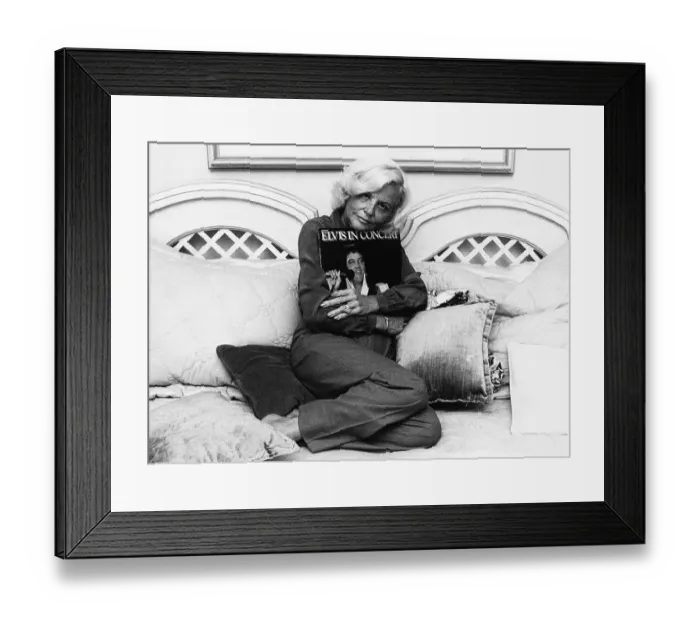 Framed Print : Dee Presley Elvis Presley step mother Dee Presley hugs the memorial album set of Elvis