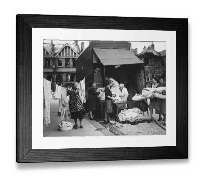 Framed Print : A mobile laundry service working from the back of a lorry accepts more washing during WW2 Framed Print : A mobile laundry service working from the back of a lorry accepts more washing during WW2