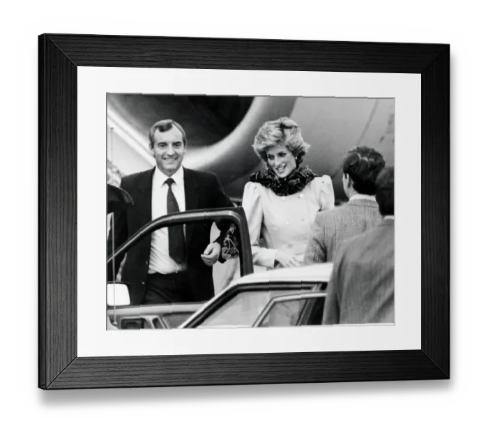 Framed Print : Princess Diana with her bodyguard at Aberdeen Airport as she interrupts her holiday in