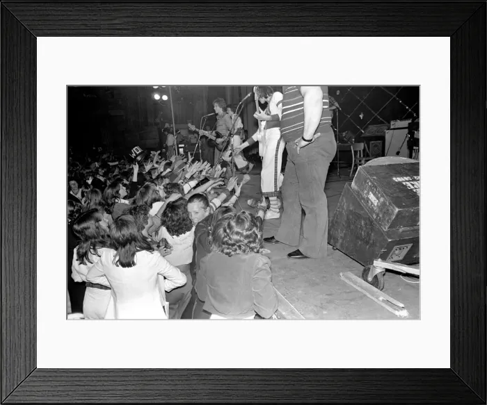 Framed Print : Fans cheer as the Bay City Rollers perform on stage at Cardiff. May 1975