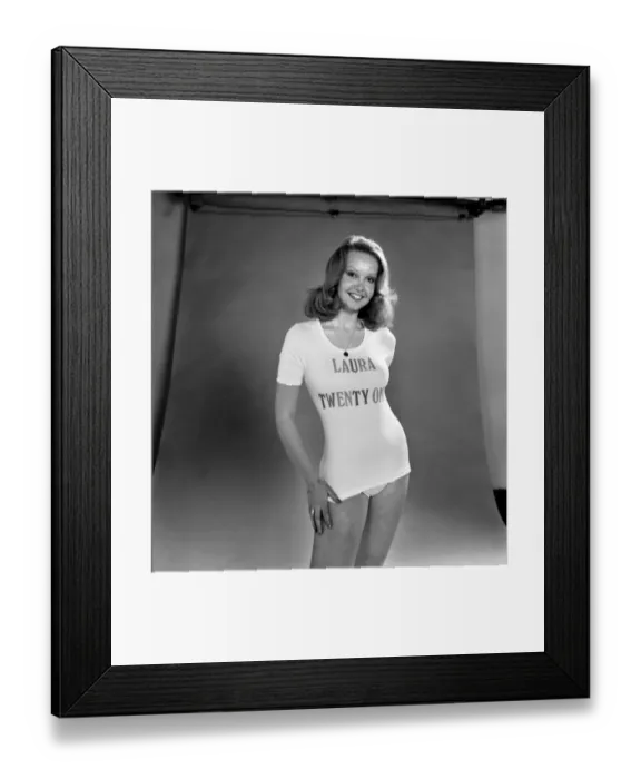 Framed Print : Actress Laura Collins poses wearing a t shirt and pair of knickers in the studio