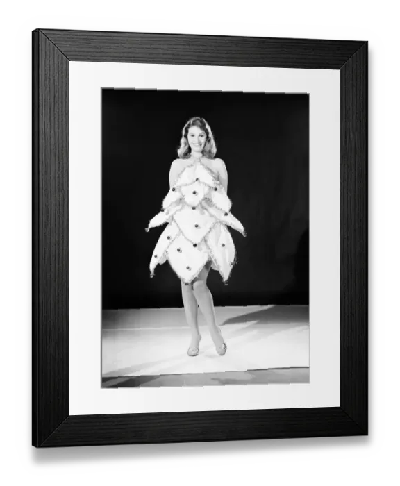 Framed Print : Clothing: Fashion: Dresses: Woman wearing Christmas tree dress. Model: Yvonne Buckingham Framed Print : Clothing: Fashion: Dresses: Woman wearing Christmas tree dress. Model: Yvonne Buckingham