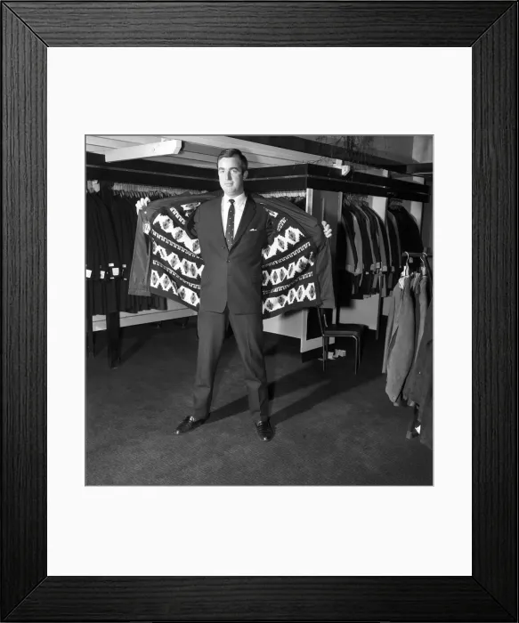Framed Print : Male model wearing raincoat in menswear department. 1966 Framed Print : Male model wearing raincoat in menswear department. 1966