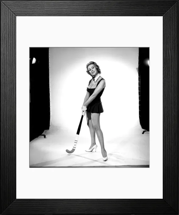 Framed Print : Rita Royce modelling sports kit with hockey stick. Circa 1959 Framed Print : Rita Royce modelling sports kit with hockey stick. Circa 1959