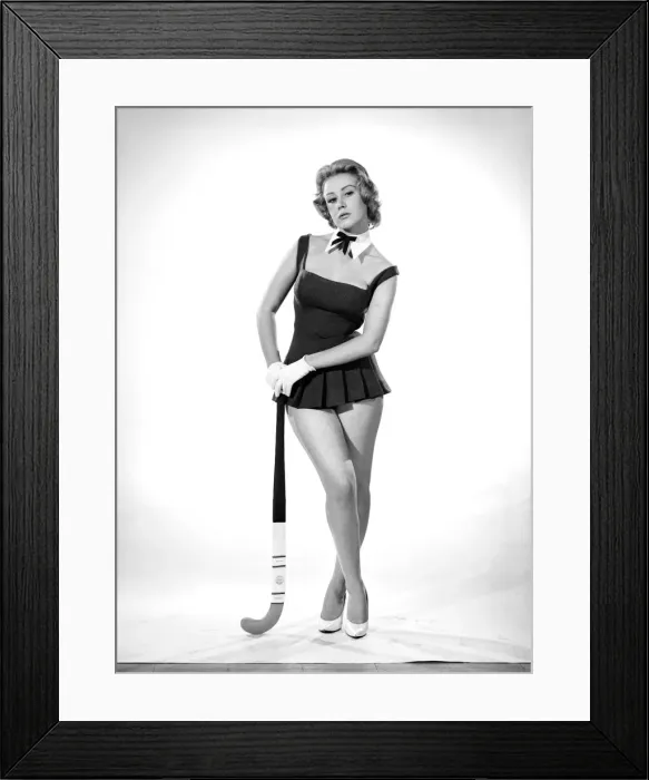 Framed Print : Rita Royce modelling sports kit with hockey stick. Circa 1959 Framed Print : Rita Royce modelling sports kit with hockey stick. Circa 1959
