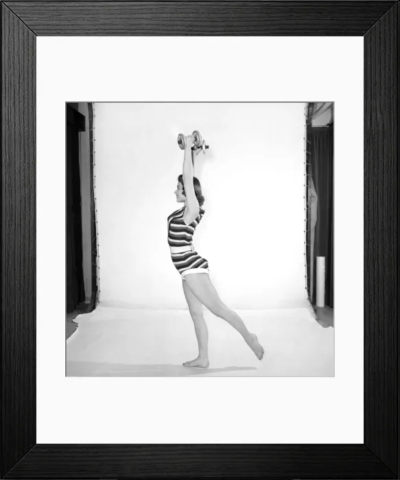Framed Print : Keep-Fit: Woman exercising with dumb bells. 1960 Framed Print : Keep-Fit: Woman exercising with dumb bells. 1960