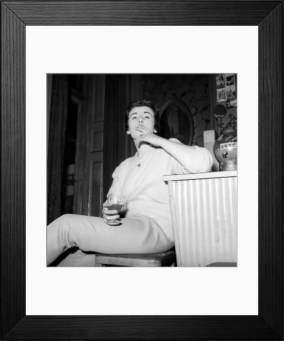 Framed Print : Woman enjoying a cigarette and a drink in a London bar. 1960 Framed Print : Woman enjoying a cigarette and a drink in a London bar. 1960