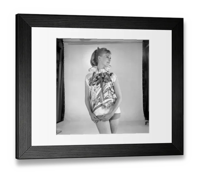 Framed Print : Woman modelling floral blouse. Circa 1960