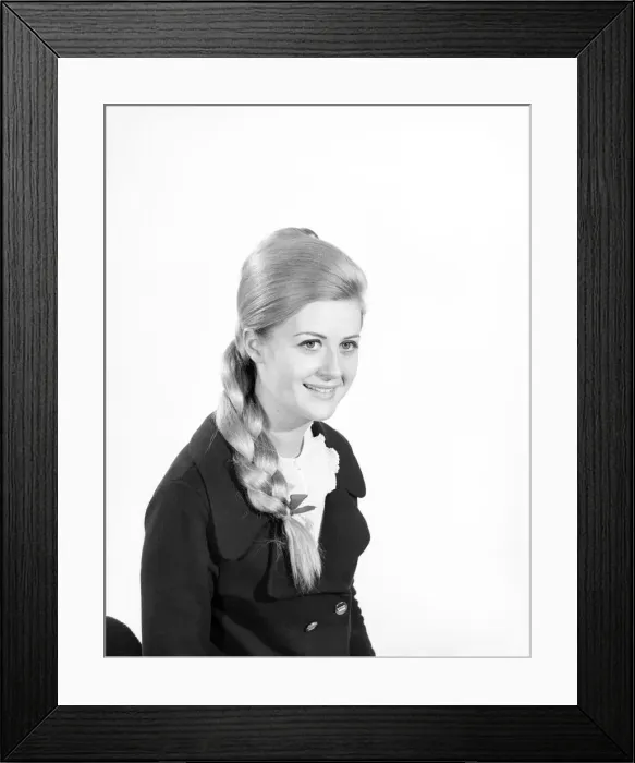 Framed Print : Woman at the beauty department of Selfridges store having a Tovar- tress attached to her