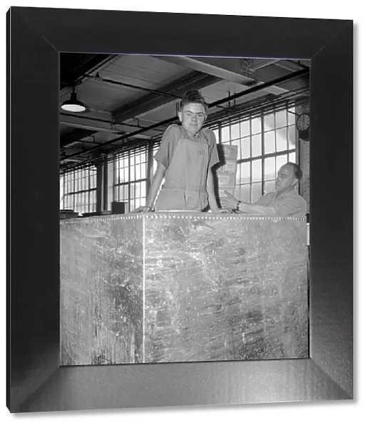 Huntley and Palmer Biscuits: Boys in biscuit factory seen here loading crate for export