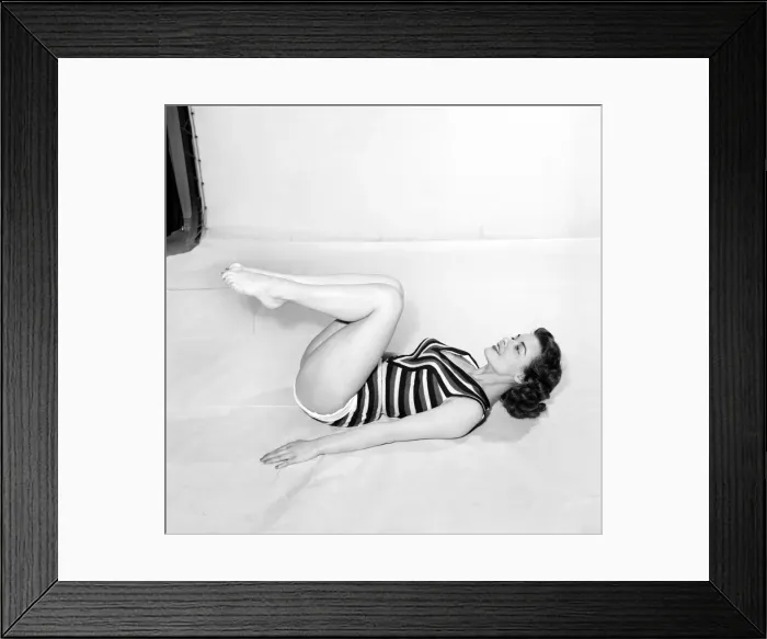 Framed Print : Keep-Fit: Woman exercising stomach muscle. 1960