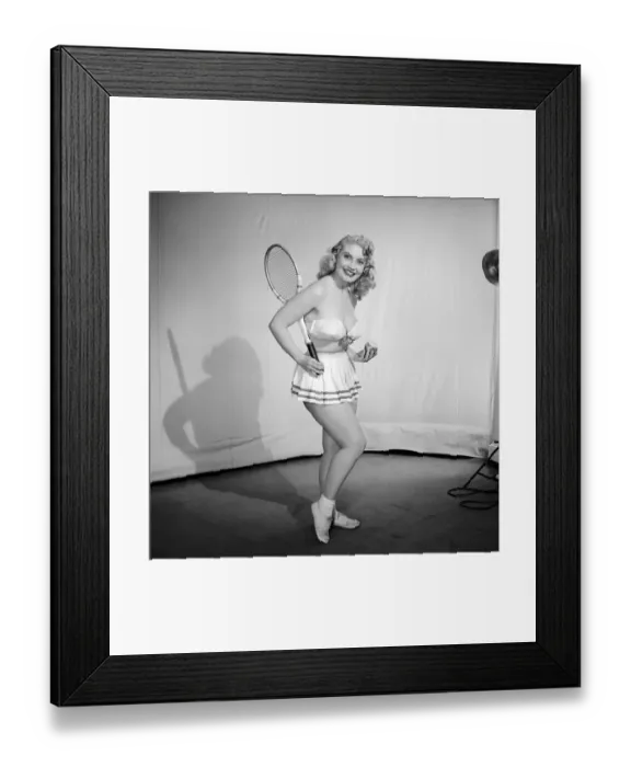 Framed Print : Anyone for tennis? Woman wearing bra, skirt holding tennis racket. 1959 Framed Print : Anyone for tennis? Woman wearing bra, skirt holding tennis racket. 1959
