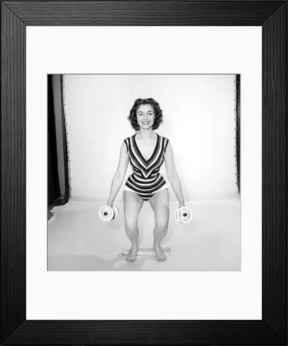 Framed Print : Keep-Fit: Woman exercising with dumb bells. 1960 Framed Print : Keep-Fit: Woman exercising with dumb bells. 1960