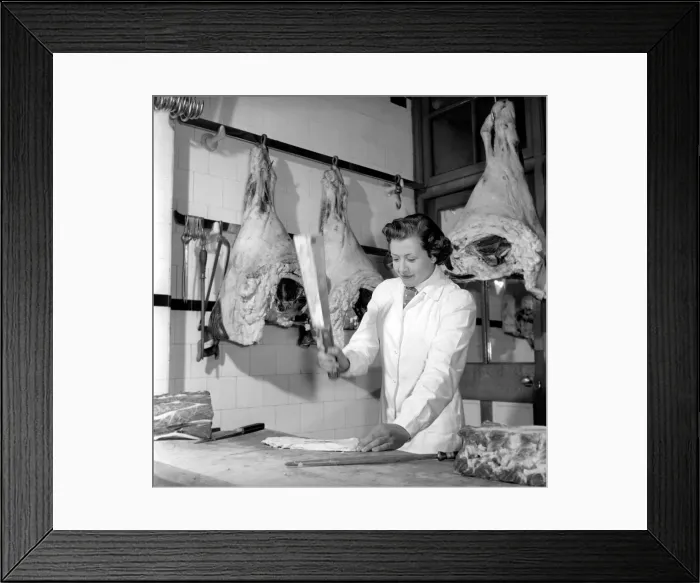 Framed Print : Woman butcher seen here at work. 1954 Framed Print : Woman butcher seen here at work. 1954