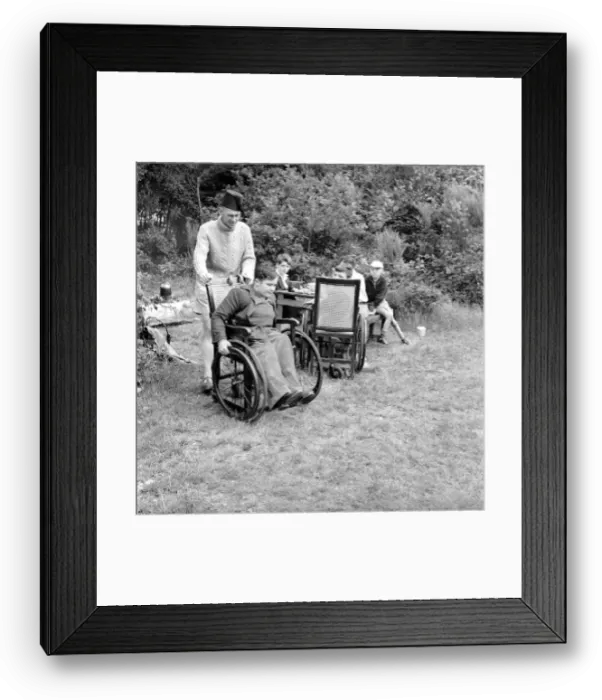 Framed Print : Disability and Youth: Tommy Hoare the legless boy scout seen here enjoying camping Framed Print : Disability and Youth: Tommy Hoare the legless boy scout seen here enjoying camping